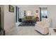 Living room with a sofa, armchair, coffee table, and tiled floor at 2740 Highlands Blvd # D, Palm Harbor, FL 34684