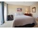 Main bedroom with carpeted floors, ample natural light, and a comfortable bed at 2740 Highlands Blvd # D, Palm Harbor, FL 34684
