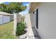 Private patio area with plants and a sliding glass door at 2740 Highlands Blvd # D, Palm Harbor, FL 34684