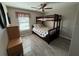 Bedroom with bunk bed, ceiling fan, and wood-look floors at 3001 58Th S Ave # 610, St Petersburg, FL 33712