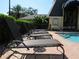 Relaxing pool area with lounge chairs for residents at 3001 58Th S Ave # 610, St Petersburg, FL 33712