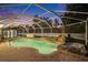 Relaxing kidney-shaped pool with a covered patio and rock waterfall feature at 31608 Loch Aline Dr, Wesley Chapel, FL 33545