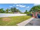 Fenced backyard with a white fence and green lawn at 4600 16Th N St, St Petersburg, FL 33703