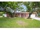 Charming single-story home with landscaped front yard and attached garage at 4600 16Th N St, St Petersburg, FL 33703