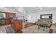 Living room with wood floors, an open view of the kitchen, and access to patio at 4600 16Th N St, St Petersburg, FL 33703
