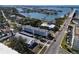 Aerial view of waterfront condo building with parking and water access at 55 Harbor View Ln # 108, Belleair Bluffs, FL 33770