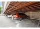 Covered parking garage with several cars parked at 55 Harbor View Ln # 108, Belleair Bluffs, FL 33770