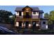 Two-story house with dark wood accents and a glass balcony at 6266 4Th S Ave, St Petersburg, FL 33707