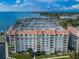 Aerial view of condo complex near marina and waterfront at 634 Edgewater Dr # 447, Dunedin, FL 34698