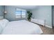 King bed, dresser, and water views at 634 Edgewater Dr # 447, Dunedin, FL 34698