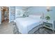 Bright bedroom with a comfortable bed and en-suite bathroom at 634 Edgewater Dr # 447, Dunedin, FL 34698