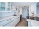 Modern kitchen with white cabinets and stainless steel appliances at 634 Edgewater Dr # 447, Dunedin, FL 34698