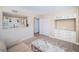 Modern white kitchen with ample cabinetry and a breakfast bar at 634 Edgewater Dr # 447, Dunedin, FL 34698