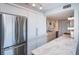 Modern kitchen with white cabinets and stainless steel appliances at 634 Edgewater Dr # 447, Dunedin, FL 34698