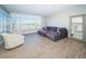 Spacious living room with water view and comfy seating at 634 Edgewater Dr # 447, Dunedin, FL 34698