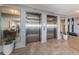 Condo lobby with elevators and modern decor at 634 Edgewater Dr # 447, Dunedin, FL 34698