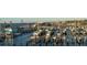 Daytime marina view with docked boats and nearby buildings at 634 Edgewater Dr # 447, Dunedin, FL 34698