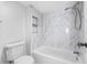 Updated bathroom with a bathtub and marble-tiled walls at 721 83Rd N Ave # 102, St Petersburg, FL 33702