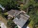 Aerial view of a house with a large yard, shed, and carport at 809 E Lambright St, Tampa, FL 33604