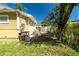 Side yard with shed and small garden area at 809 E Lambright St, Tampa, FL 33604