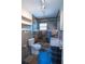 Updated bathroom with walk-in shower and floating vanity at 809 E Lambright St, Tampa, FL 33604