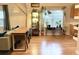 Bright dining area with wood floors and a long, live-edge dining table at 809 E Lambright St, Tampa, FL 33604