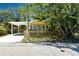 Yellow house with carport and a picket fence at 809 E Lambright St, Tampa, FL 33604