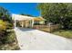 House with driveway and a picket fence at 809 E Lambright St, Tampa, FL 33604