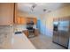 Updated kitchen with stainless steel appliances and light wood cabinets at 809 E Lambright St, Tampa, FL 33604