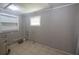 Small laundry room with washer and dryer hookups at 809 E Lambright St, Tampa, FL 33604