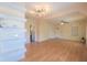 Spacious living room with built-in shelving and wood floors at 809 E Lambright St, Tampa, FL 33604
