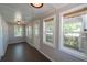 Spacious sunroom with ample natural light and hardwood floors at 809 E Lambright St, Tampa, FL 33604
