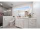Modern bathroom with white vanity, large mirror and a walk-in shower at 8390 64Th N St, Pinellas Park, FL 33781