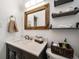 Clean bathroom with a vanity, toilet, and floating shelves at 8390 64Th N St, Pinellas Park, FL 33781