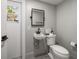 Small bathroom with pedestal sink and toilet at 8390 64Th N St, Pinellas Park, FL 33781