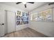 Light-filled bedroom with wood floors and art gallery wall at 8390 64Th N St, Pinellas Park, FL 33781