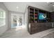 Bedroom with double doors leading to private balcony, built-in entertainment center at 8390 64Th N St, Pinellas Park, FL 33781