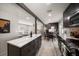 Open concept kitchen with island, dark cabinets, and breakfast nook at 8390 64Th N St, Pinellas Park, FL 33781