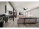 Open living room with hardwood floors and a large TV at 8390 64Th N St, Pinellas Park, FL 33781