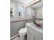 Stylish bathroom with unique bowl sink, granite countertop, and decorative mirror at 9901 1St E St # F, Treasure Island, FL 33706