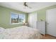 Cozy bedroom with a floral bedspread and built-in closet at 9901 1St E St # F, Treasure Island, FL 33706