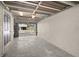 View of the empty carport showing the garage door and entrance to the home at 9901 1St E St # F, Treasure Island, FL 33706