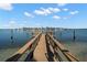 Private wooden dock extending into the water at 9901 1St E St # F, Treasure Island, FL 33706