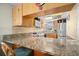 Kitchen features granite countertops and stainless steel appliances at 9901 1St E St # F, Treasure Island, FL 33706