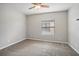 Spacious bedroom with ceiling fan and carpeted floor at 127 Silver Falls Dr, Apollo Beach, FL 33572