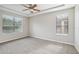 Spacious bedroom with neutral walls, carpeted floors, and large windows at 127 Silver Falls Dr, Apollo Beach, FL 33572