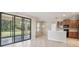 Kitchen with wooden cabinets, black appliances, and a breakfast bar at 127 Silver Falls Dr, Apollo Beach, FL 33572