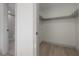 Walk-in closet with built-in shelves and hardwood floors at 12939 116Th St, Largo, FL 33778