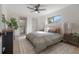 Main bedroom with a cozy bed and ensuite bathroom access at 12939 116Th St, Largo, FL 33778