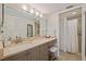 Clean bathroom with vanity, large mirror, and shower at 1316 Pasadena S Ave # 203, South Pasadena, FL 33707